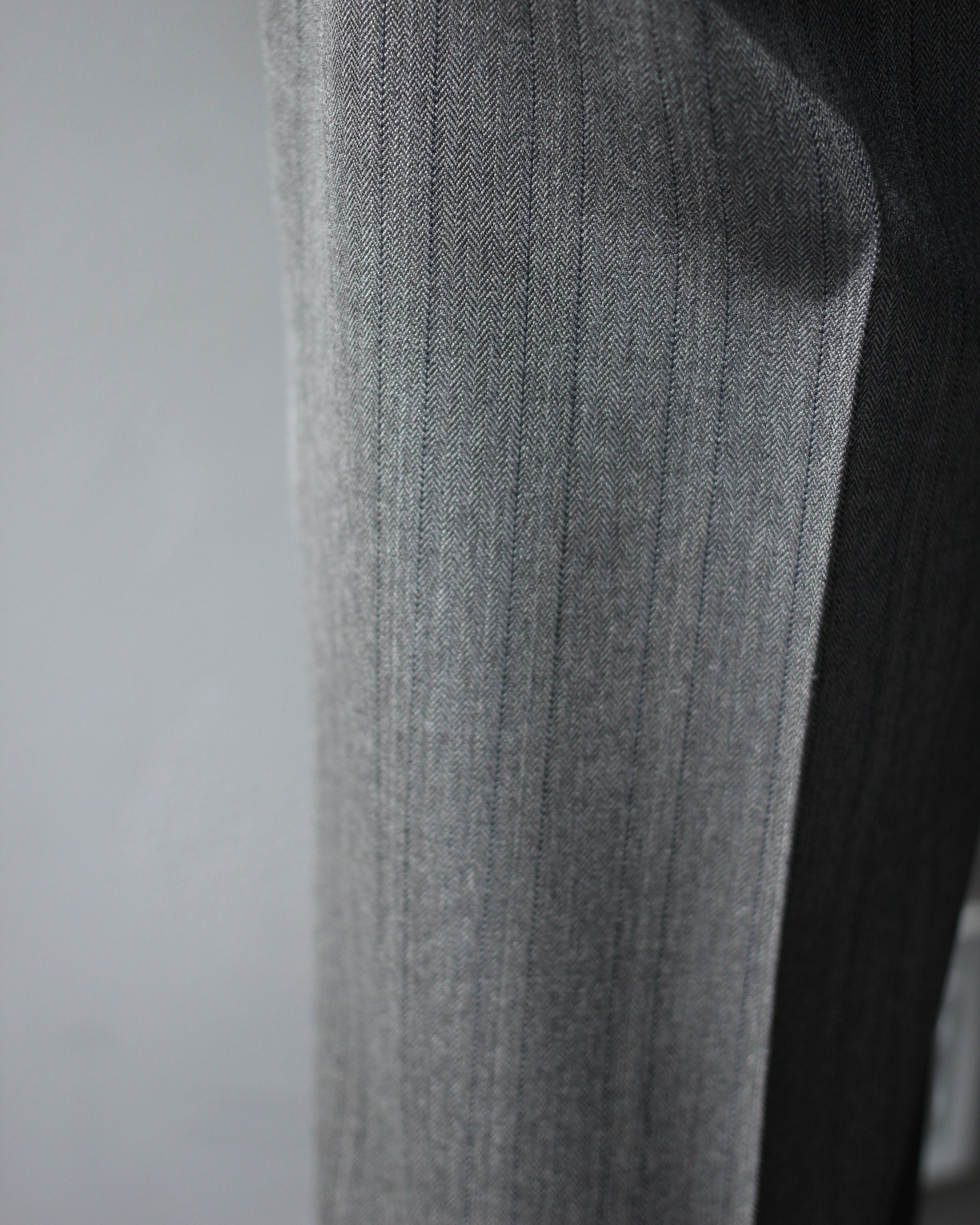 ULTERIOR / MELANGE HERRINGBONE STRIPE TUCKED TROUSERS